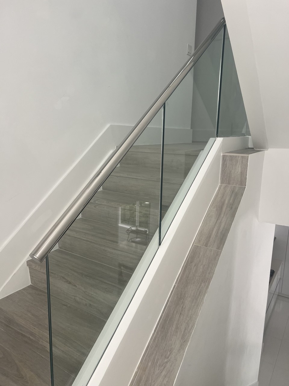 Glass stair railing installation in Boca Raton by Safe Railing